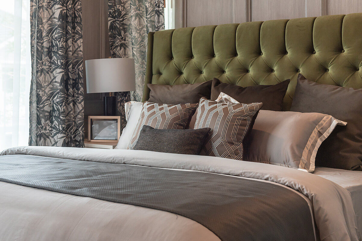 Image of bed with pillows and comforter